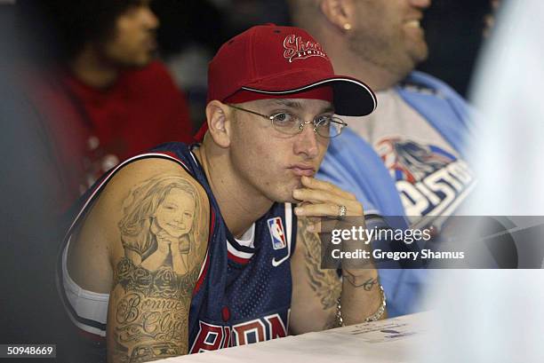 Rapper Eminem attends game three of the 2004 NBA Finals between the Detroit Pistons and the Los Angeles Lakers June 10, 2004 at the Palace of Auburn...