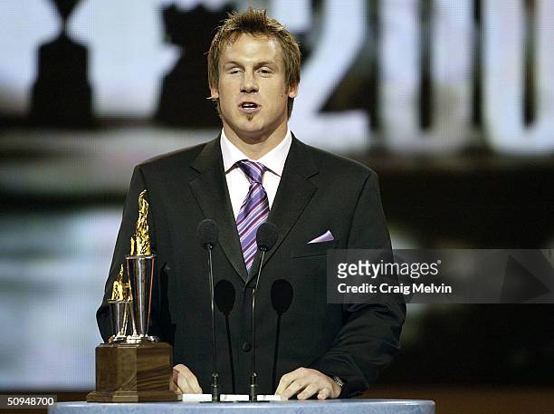 Bryan Berard of the Chicago Blackhawks winner of the Bill Masterton Trophy, awarded annually to the player who best exemplifies the qualaties of...