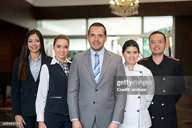 happy hotel staff - uniform stock pictures, royalty-free photos & images