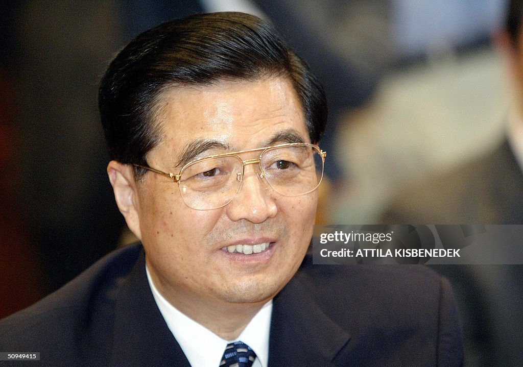 A portrait of President Hu Jintao (L) of