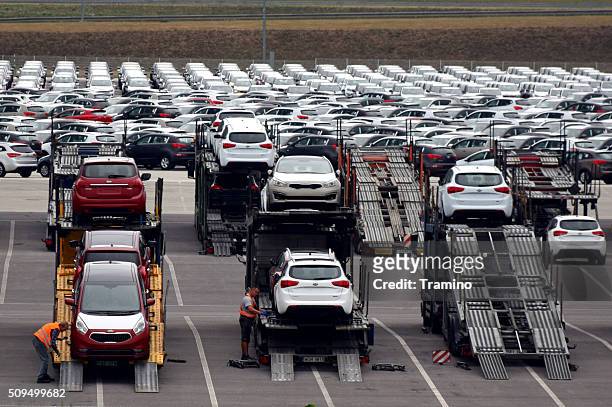 car transporter lorries on the car factory parking - zilina stockfoto's en -beelden