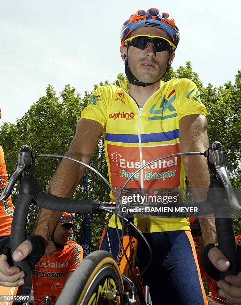 Yellow and blue jersey Spanish Iban Mayo waits before the start of the fifth stage of the "56th Criterium du Dauphine Libere", between Bollene and...