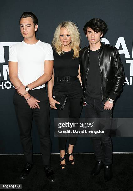 Actress Pamela Anderson and sons Brandon Lee and Dyland Lee attend Saint Laurent at Hollywood Palladium on February 10, 2016 in Los Angeles,...