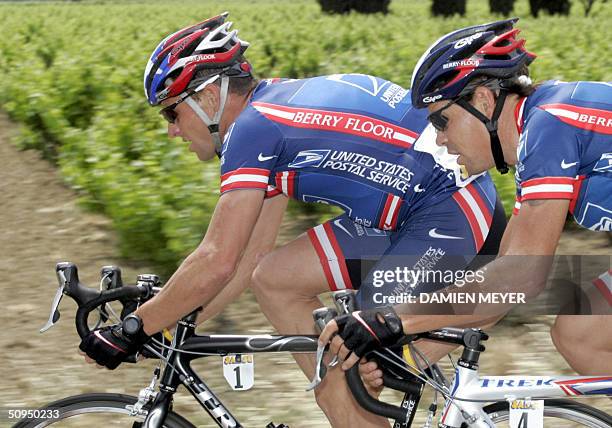 Lance Armstrong pedals with teammate Russian Viatcheslav Ekimov during the fifth stage of the "56th Criterium du Dauhine Libere", between Bollene and...