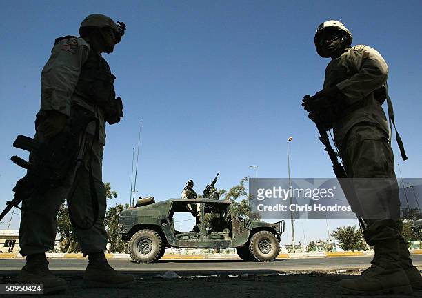 Soldiers from the 2nd Armoured Cavalry Regiment from Fort Polk, La., stand on patrol on June 11 2004, in downtown Najaf, Iraq. Tensions remain high...