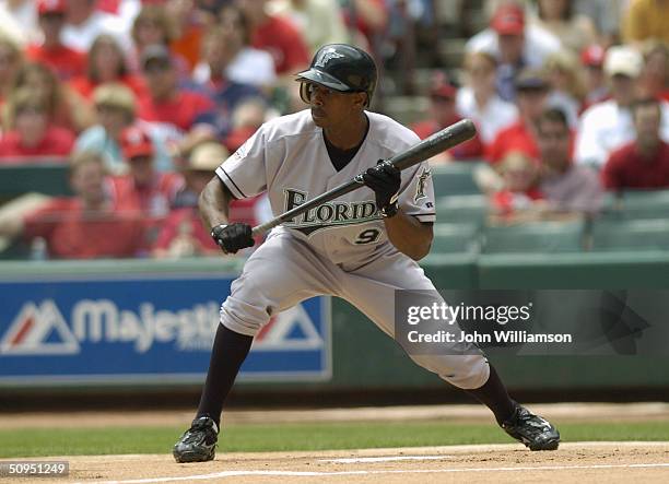 Outfielder Juan Pierre of the Florida Marlins bunts against the St. Louis Cardinals during the game at Busch Stadium on May 15, 2004 in St. Louis,...