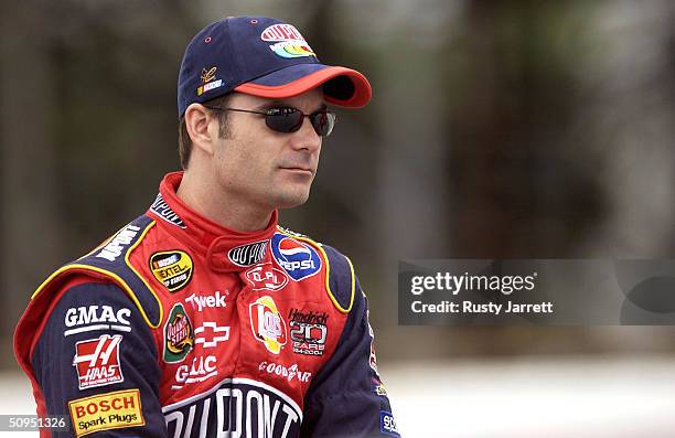 Jeff Gordon, driver of the Hendrix Motorsports Dupont Chevrolet, looks on during qualifying for the Nextel Cup Pocono 500 on June 11, 2004 at Pocono...