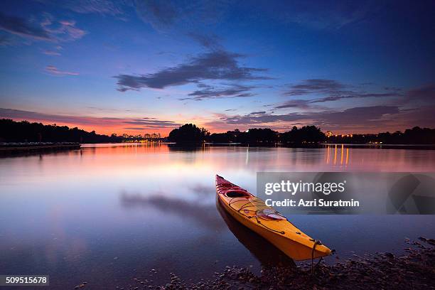 canoe on water during sunset - eastern usa stock pictures, royalty-free photos & images