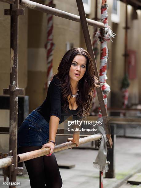 beautiful brunette on a construction site. - glasgow people stock pictures, royalty-free photos & images