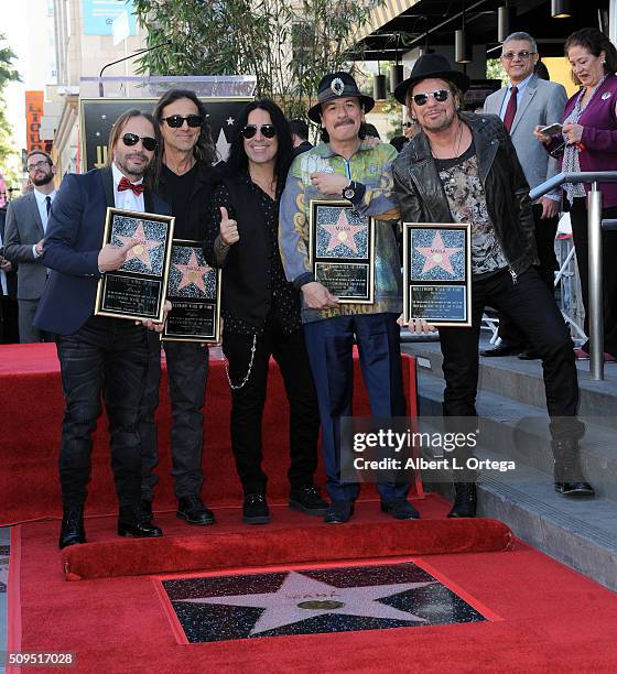 Musician Carlos Santana with Mana at the Mana Star ceremony on The Hollywood Walk of Fame held on February 10, 2016 in Hollywood, California.