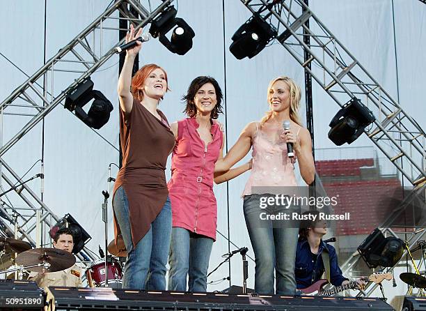Sisters Kelsi, Kassidy and Kristyn Osborn of the country music group Shedaisy performs onstage at the 2004 CMA Music Festival June 11, 2004 in...