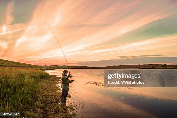 fly fishing at sunset, loch thom, clyde muirshiel - fly fishing fotografías e imágenes de stock