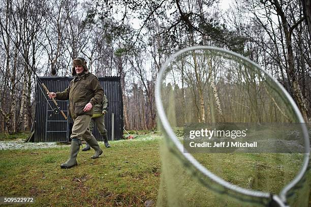 Anglers attend the opening day of the salmon season on the River Spey on February 11, 2016 in Aberlour, Scotland. The annual opening day ceremony...