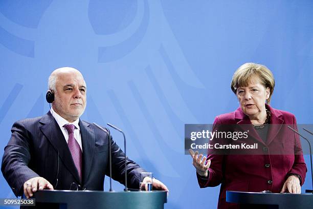 German Chancellor Angela Merkel and Iraqi Prime Minister Haider al-Abadi speak to the media following talks at the Chancellery on February 11, 2016...