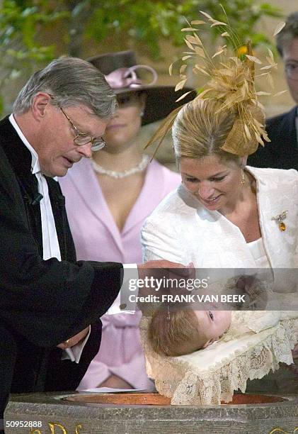 The daughter of Dutch Crown Prince Willem-Alexander and Princess Maxima, Catharina- Amalia, is held by her mother during the christening at St-Jacobs...