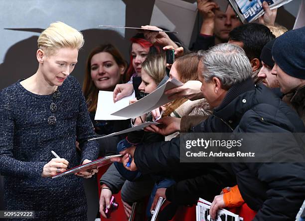 Tilda Swinton writes autographs at the 'Hail, Caesar!' photo call during the 66th Berlinale International Film Festival Berlin at Grand Hyatt Hotel...