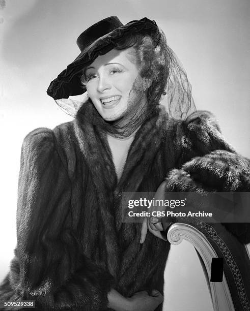 Actress Irene Rich models hat fashions. She is heard on the CBS Radio program, Dear John, as Faith Chandler. New York, NY. Image dated June 1, 1942.