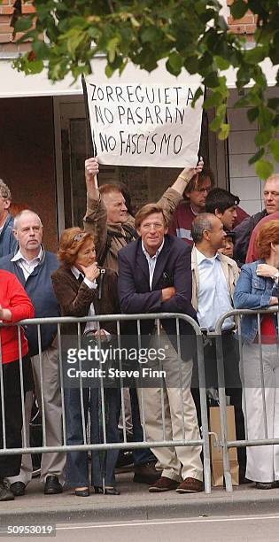 Protestor holds a sign against Jorge Zorreguieta, the father of Princess Maxima of the Netherlands at the Christening of baby girl Catharina-Amalia,...