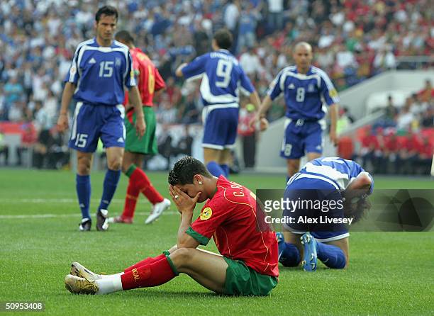 Dejected Cristiano Ronaldo of Portugal after bringing down Georgios Seitardis of Greece to give a penalty during the Portugal v Greece Group A...