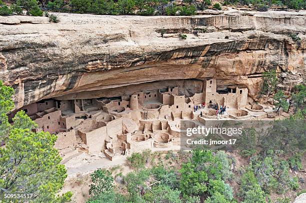 visitors at the cliff place - cliff dwelling stock pictures, royalty-free photos & images