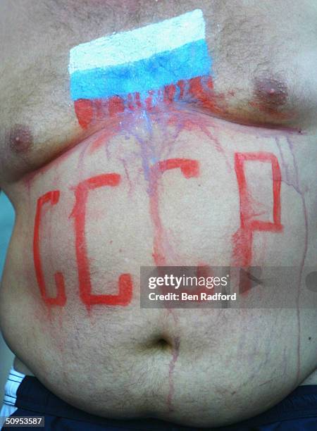 Russian fan reveals his painted stomach during the Spain v Russia Group A match in the 2004 UEFA European Football Championships at the Estadio...