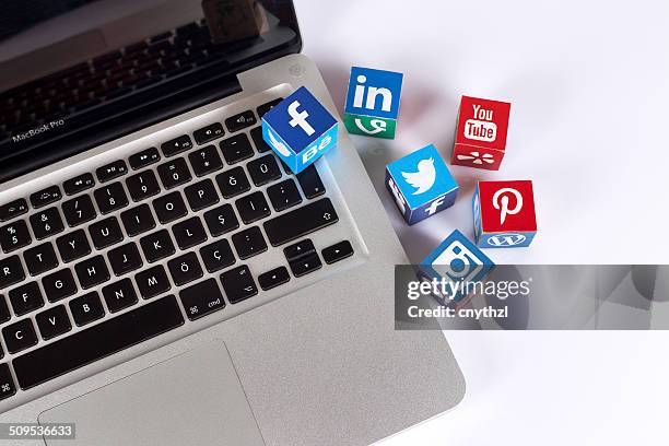 social media logos on the laptop - google social networking service stock pictures, royalty-free photos & images