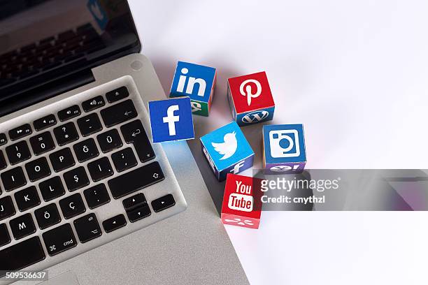 social media logos on the laptop - google social networking service stock pictures, royalty-free photos & images