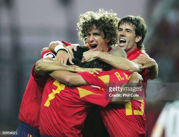 Spain players congratulated Juan Carlos Valeron of Spain after he scores their first goal during the Spain v Russia Group A match in the 2004 UEFA...