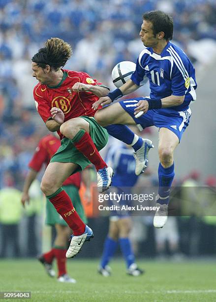 Maniche of Portugal clashes with Themistoklis Nikolaidis of Greece during the Portugal v Greece Group A opening match, from the 2004 UEFA European...