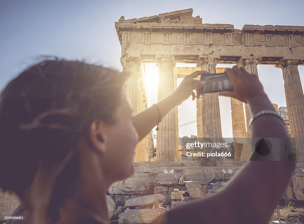 Woman taking picture to Parthenon