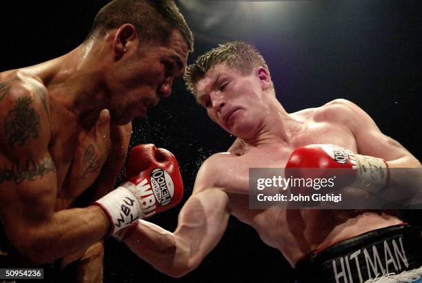 Ricky Hatton connects with a right body shot during the fight between Ricky Hatton and Carlos Vilches on June 12 at the MEN Arena in Manchester,...