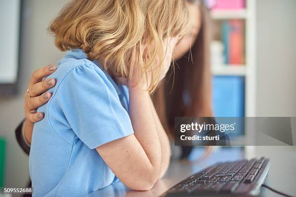 worried schoolchild - teacher using interactive whiteboard stock pictures, royalty-free photos & images