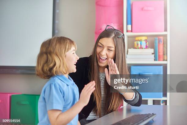 high five schoolgirl in ict class - kids proud bildbanksfoton och bilder