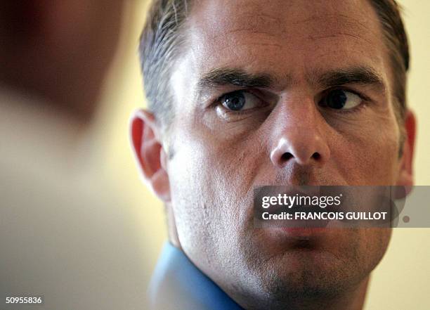 Dutch defender Frank de Boer listens to journalists' questions during a press conference in Albuferia, 13 June 2004 during the 2004 European Nations...