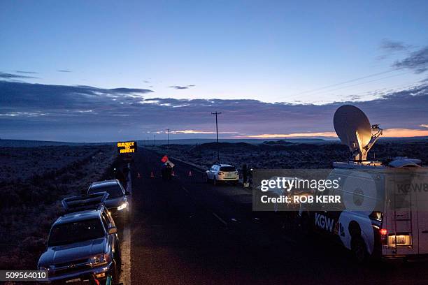Media wait at a checkpoint about 4 miles from the Malheur Wildlife Refuge Headquarters near Burns, Oregon, on February 11, 2016. The FBI surrounded...