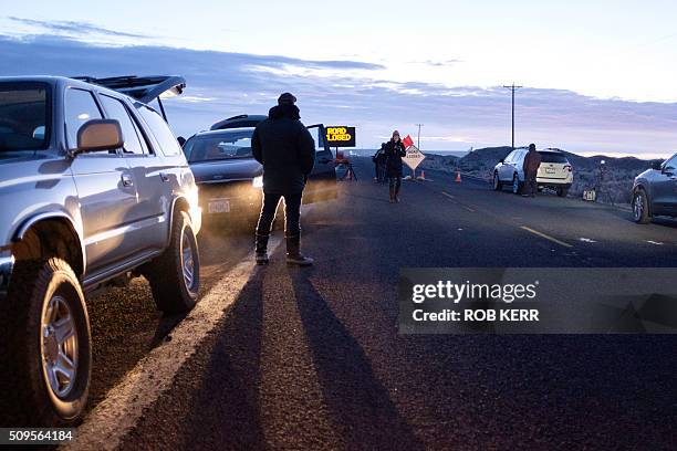 Media wait at a checkpoint about 4 miles from the Malheur Wildlife Refuge Headquarters near Burns, Oregon, on February 11, 2016. The FBI surrounded...