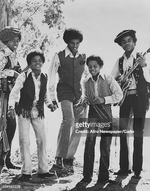 The Jackson Five singing and playing guitars outdoors, from left Tito, Michael, Toriano, Jackie, and Jermaine, 1975. .