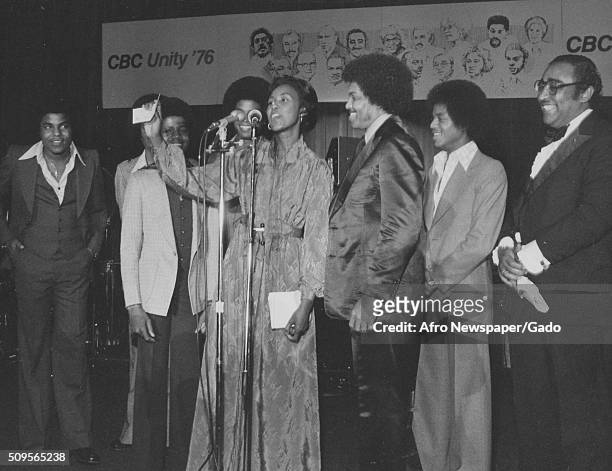 The Jackson Five, with Joe Jackson, on stage at the Congressional Black Caucus, Yvonne Brathwaite Burke, the committees chair, at the microphone,...