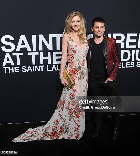 Model Elle Evans and recording artist Matthew Bellamy of Muse attend the Saint Laurent show at The Hollywood Palladium on February 10, 2016 in Los...