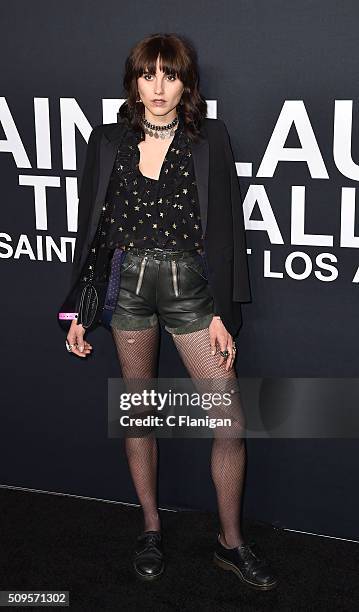 Artist Langley Fox, in Saint Laurent by Hedi Slimane, arrives at the Saint Laurent show at the Hollywood Palladium on February 10, 2016 in Los...