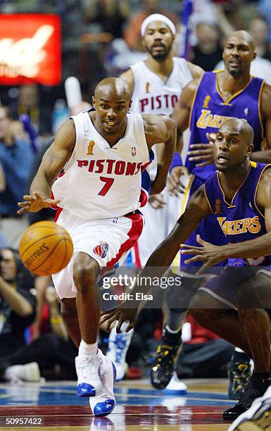 Mike James of the Detroit Pistons dribbles past Gary Payton of the Los Angeles Lakers during the second quarter in game four of the 2004 NBA Finals...