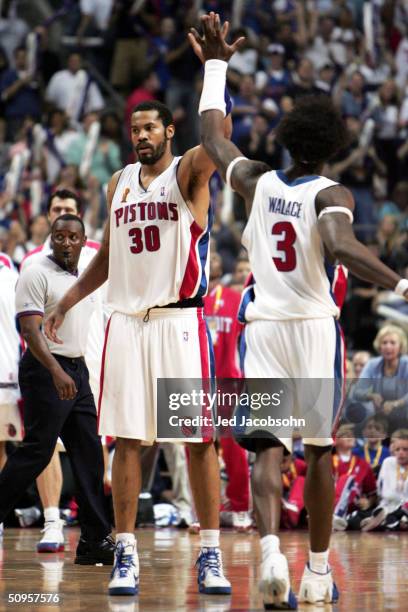 Rasheed Wallace and Ben Wallace of the Detroit Pistons celebrate in the fourth quarter of game four of the 2004 NBA Finals against the Los Angeles...