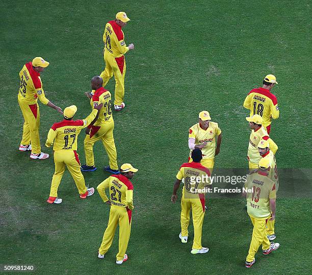 The Sagittarius Strikers players celebrate the wicket of Virender Sehwag during the Oxigen Masters Champions League Semi Final match between Gemini...