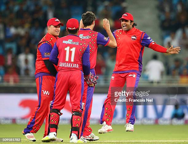 Graham Onions of Gemini celebrates the wicket of Adam Gilchrist of Sagittarius with his team-mates during the Oxigen Masters Champions League Semi...