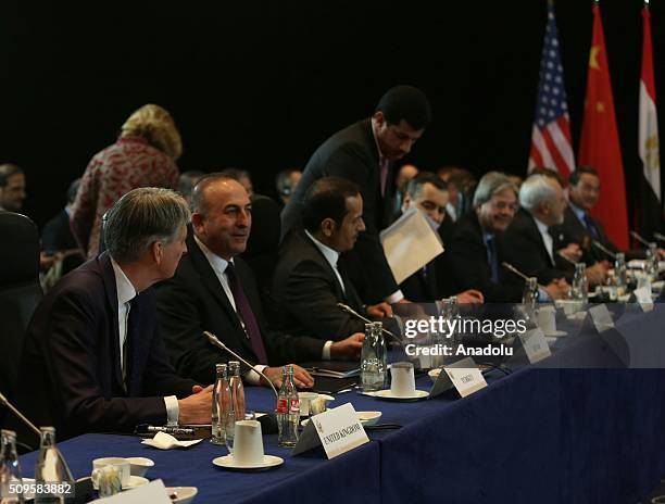 British Foreign Minister Philip Hammond , Turkish Foreign Minister Mevlut Cavusoglu and Qatar's Foreign Minister Sheikh Mohammed bin Abdulrahman bin...