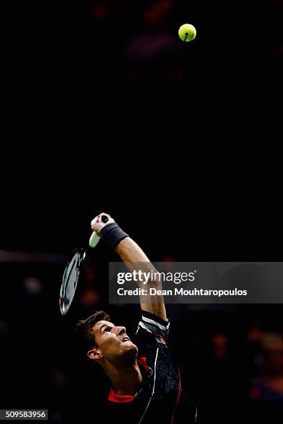 Martin Klizan of Slovakia in action against Marcos Baghdatis of Cyprus during day 4 of the ABN AMRO World Tennis Tournament held at Ahoy Rotterdam on...