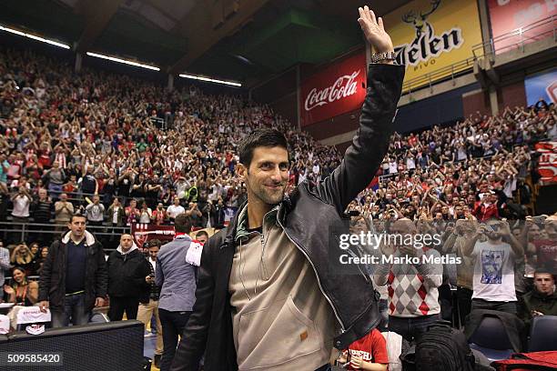 Novak Djokovic waves to the audience during the Turkish Airlines Euroleague Basketball Top 16 Round 7 game between Crvena Zvezda Telekom Belgrade v...