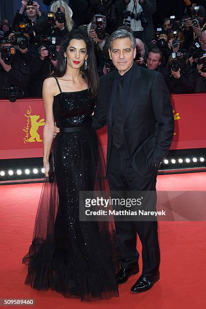 George Clooney and his wife Amal attend the 'Hail, Caesar!' premiere during the 66th Berlinale International Film Festival Berlin at Berlinale Palace...