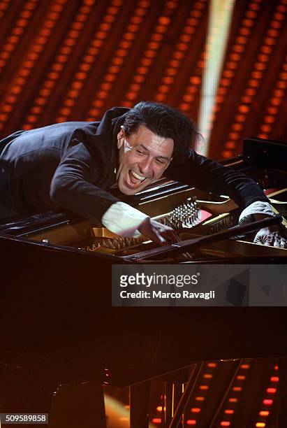 Italian musician Ezio Bosso performs on stage during the Sanremo Italian Song Festival at the Ariston theater on February 10, 2016 in Sanremo, Italy....