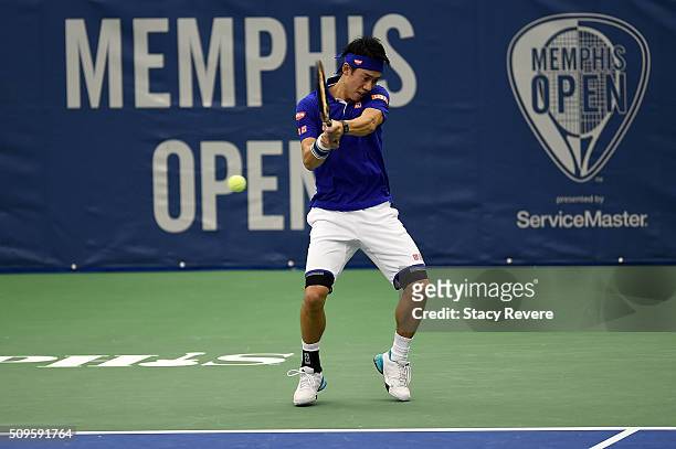 Kei Nishikori of Japan returns a shot to Ryan Harrison of the United States during their singles match on Day 3 of the Memphis Openat the Racquet...